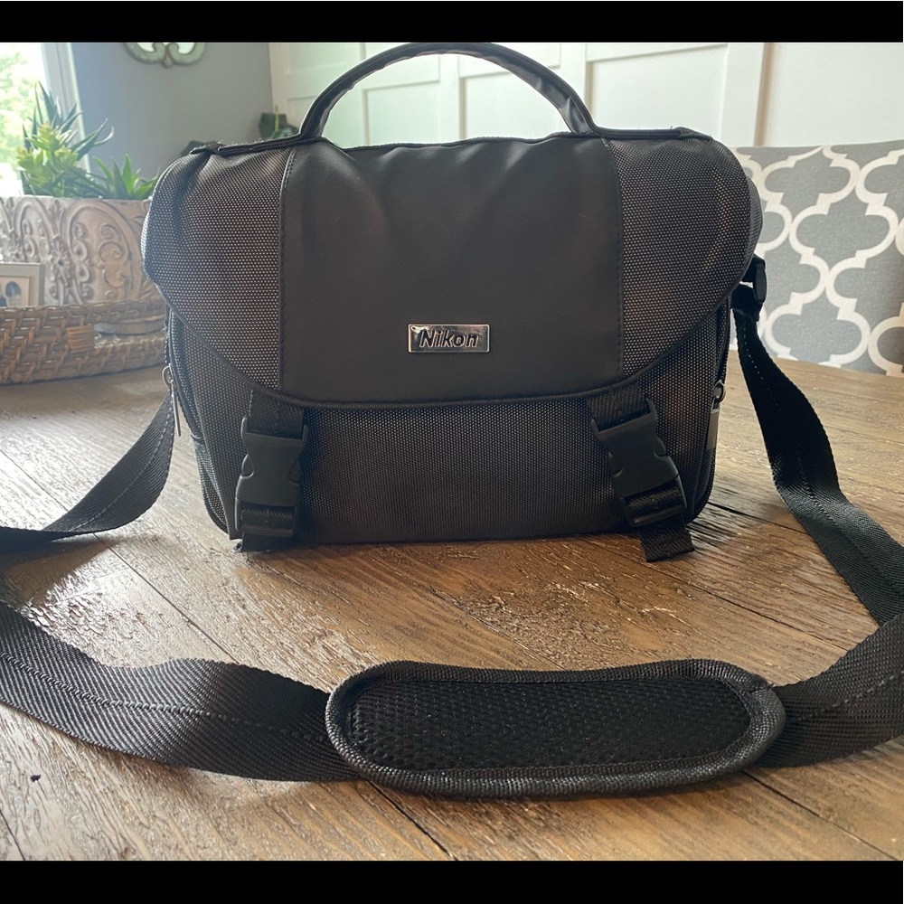 Nikon case with shoulder strap.